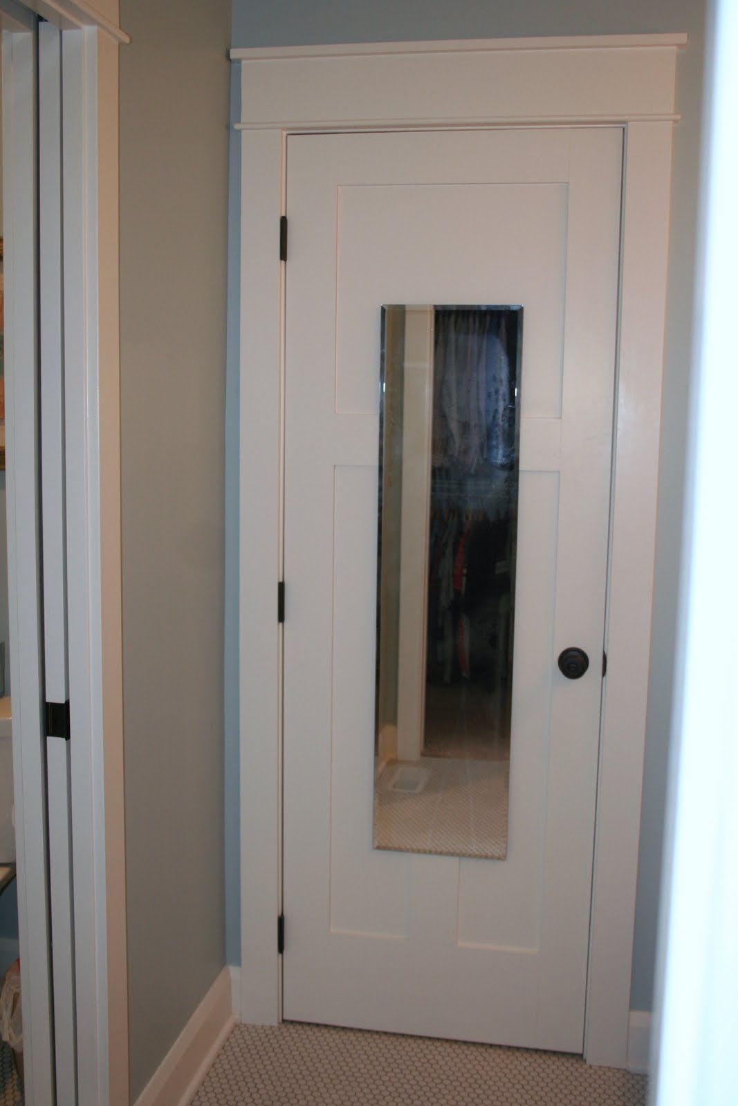 How do you hang a bathroom mirror?